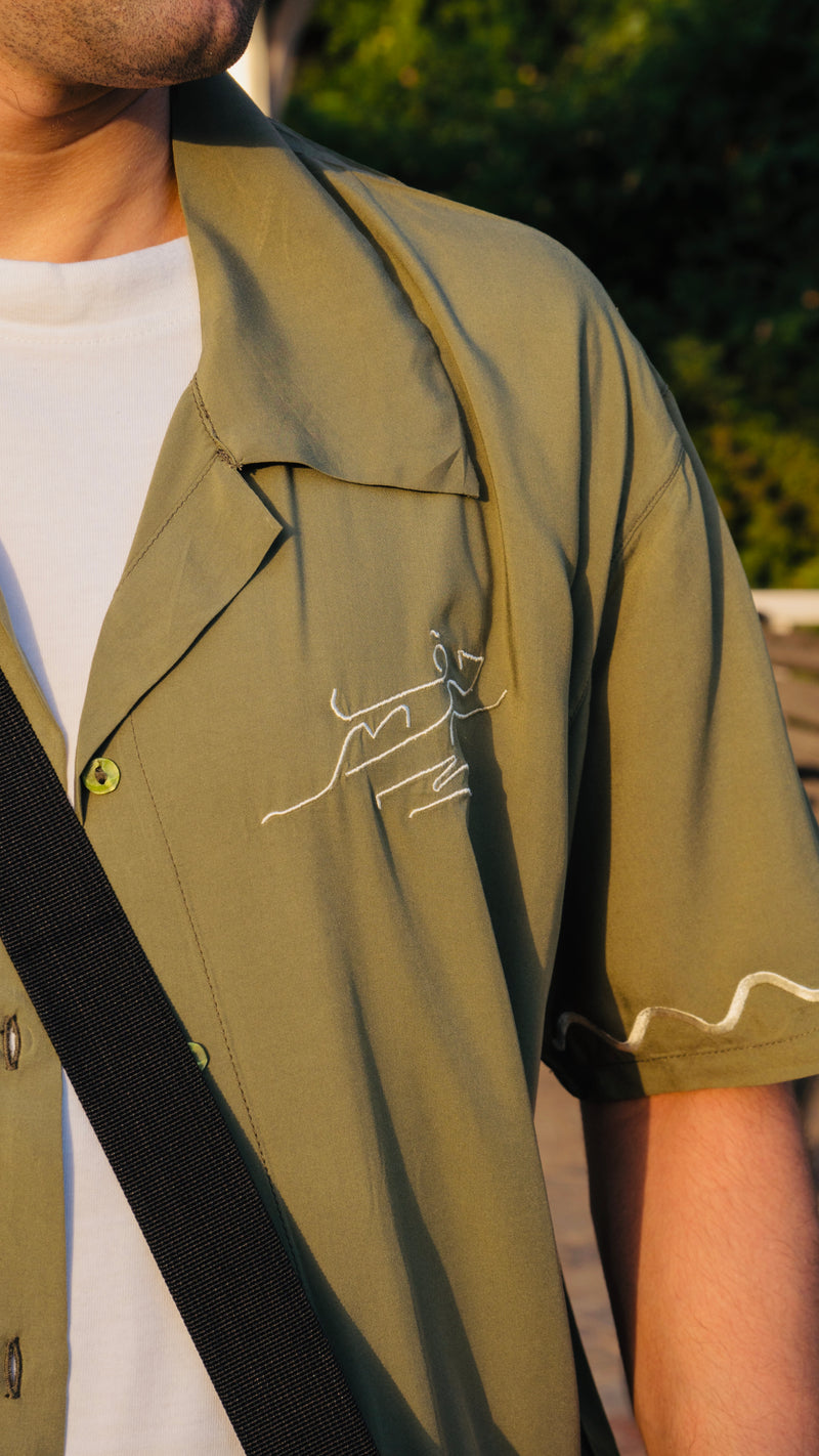 Green button down shirt